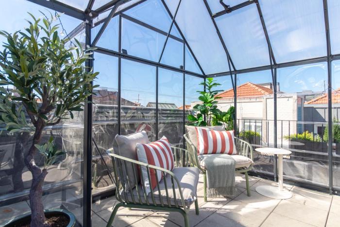 Rooftop Glasshouse Retreat by LovelyStay