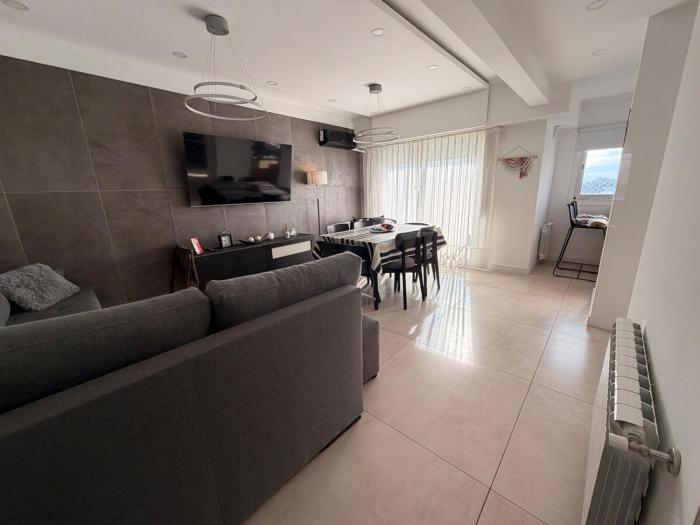 Modern apartment with balconies and open views
