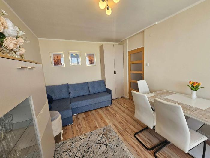 Cozy Apartment with a Balcony Near the Center and PGE Stadium by Noclegi Renters