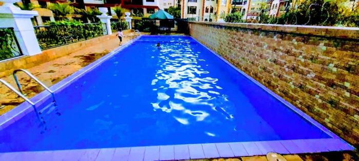 serenity heights two bedroom apartment with swimming pool fully equipped gym ample parking space child play area and amazing scenic views