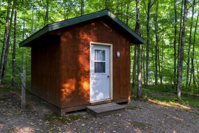 Rustic Cabin Nestled in the Trees for a Unique Outdoor Experience in White Lake, Wisconsin