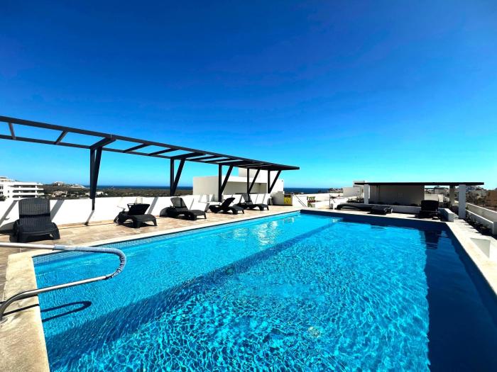 Bahia del Tezal 103b Modern 1BR Retreat with Rooftop Pool & Beach Access