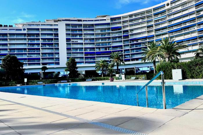 Marina view apartment terrace & pool