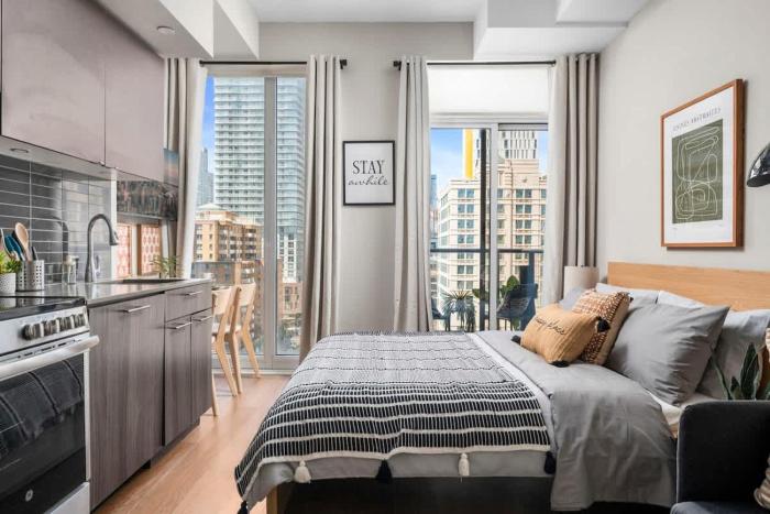 Modern Downtown Studio with Balcony & City Views