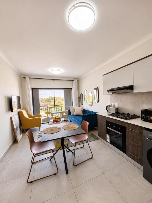 Cozy airport stay with gym and workspace