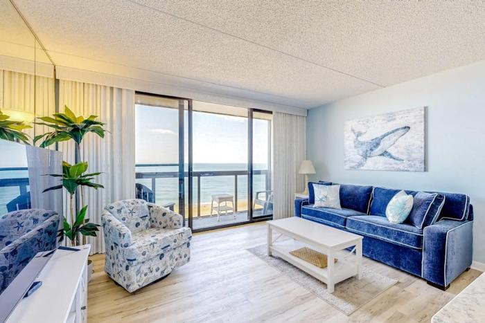 Captivating beachfront condo with balcony views pools gym & tennis court