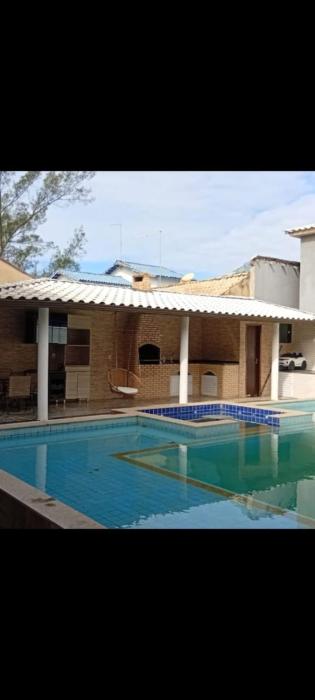 Casa pé na área com hidromassagem e piscina