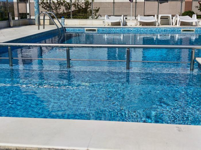 Apartment with free pool and parking space