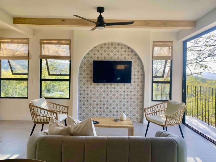 Private home in Playa Potrero near Flamingo with Infinity pool, 9 minute walk to beach, ocean, mountain, nature views, TV and AC in every room
