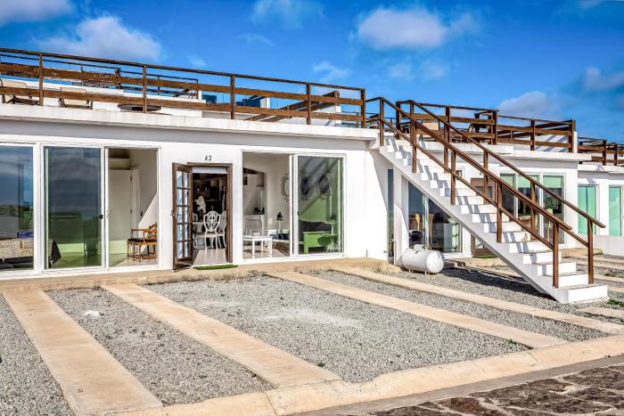 Dog-Friendly Oceanfront Villa with Rooftop Patio, Pool Access, & Kitchen
