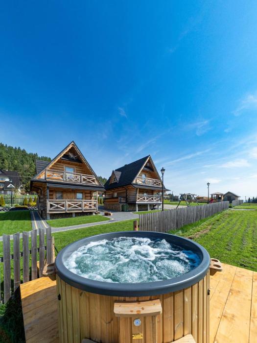 Osada Szaflary - jacuzzi na wyłączność dla każdego domku, ogólnodostępna sauna i plac zabaw w cenie
