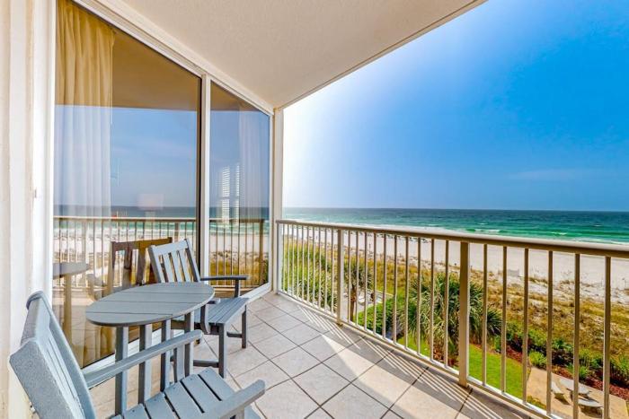 Beachfront condo with balcony Gulf views pools & fitness room