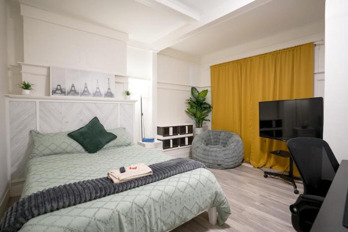 Spacious Room with Large TV & Standing Desk