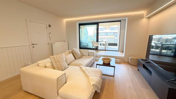 Spacious family duplex with sunny terrace near the beach