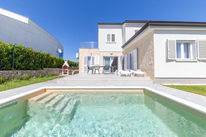 Summer Oasis by Belmont Realty