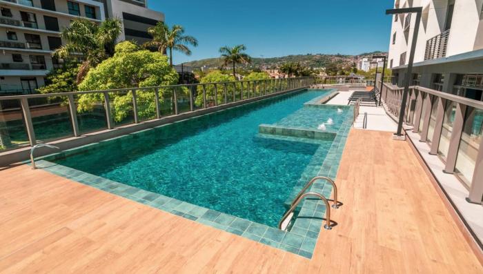 Studio completo, piscina e academia - 5 min da PUC