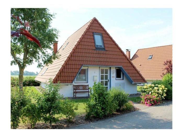 Holiday home in Wremen with swimming pool
