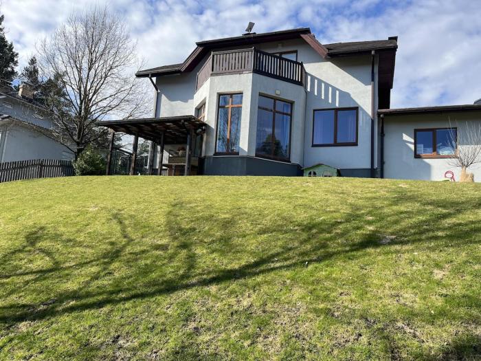 Modern house near a forest on the border with Riga