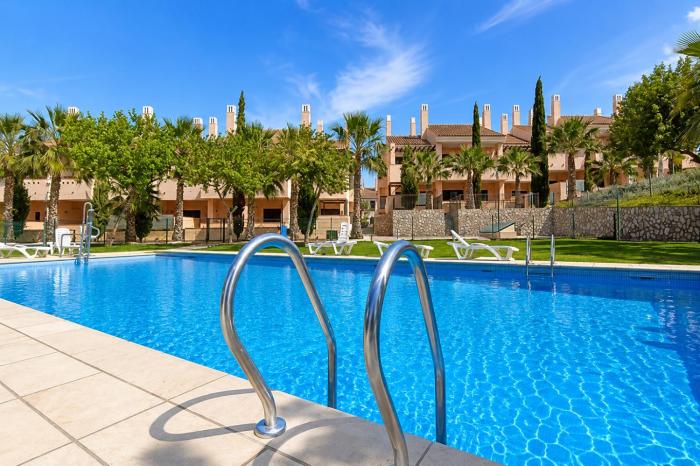 Luxury apartment with terrace and pool views on golf resort