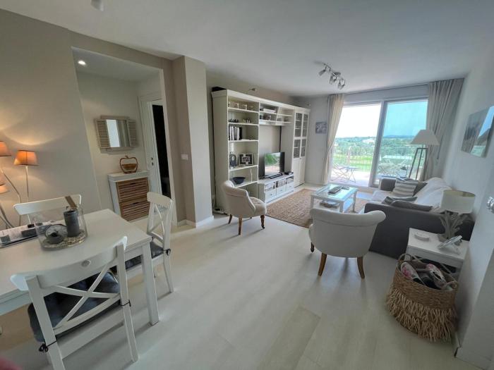 Condo with golf course views, pool and terraces