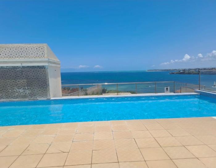 Karibu Seaview palm terrace apt nyali