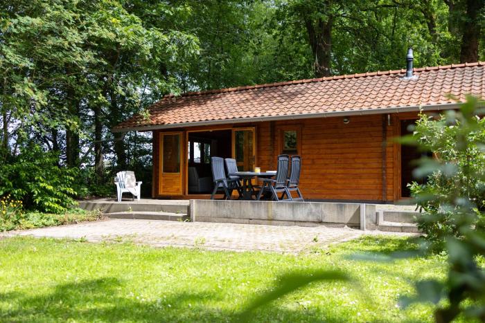 Knus houten huisje voor stellen en gezinnen met ruime tuin op de Veluwe