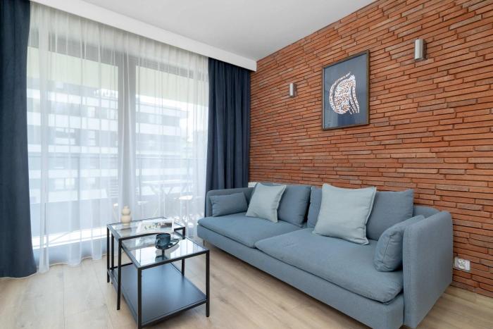 Stylish Apartment with Parking & Workspace Close to the City Centre by Noclegi Renters