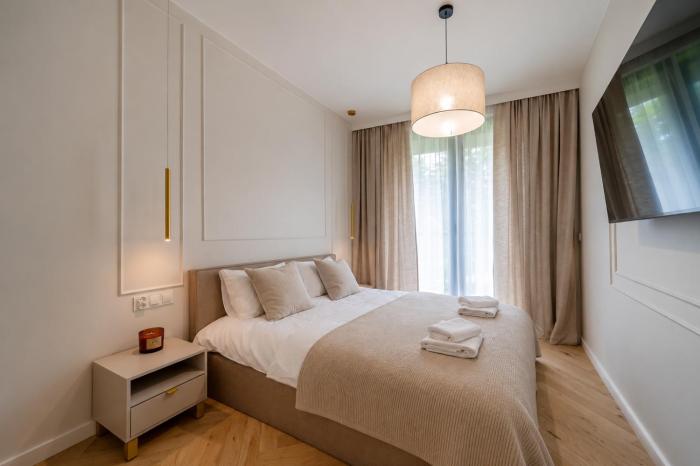 Apartament Vidok 216 by Warmia4Rent, z widokiem na jezioro