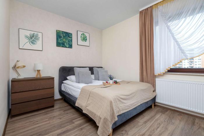 Spacious Apartment with a Workspace and Balcony near the Water Park by Noclegi Renters