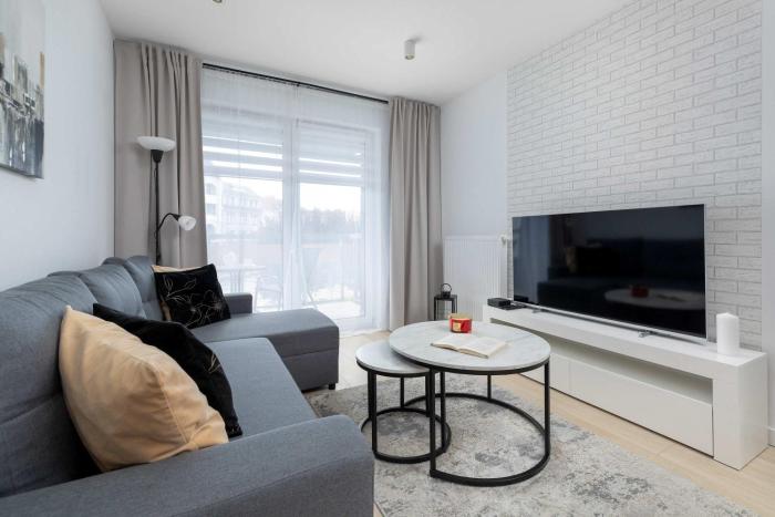 Modern Apartment in the City Centre with a Balcony by Noclegi Renters