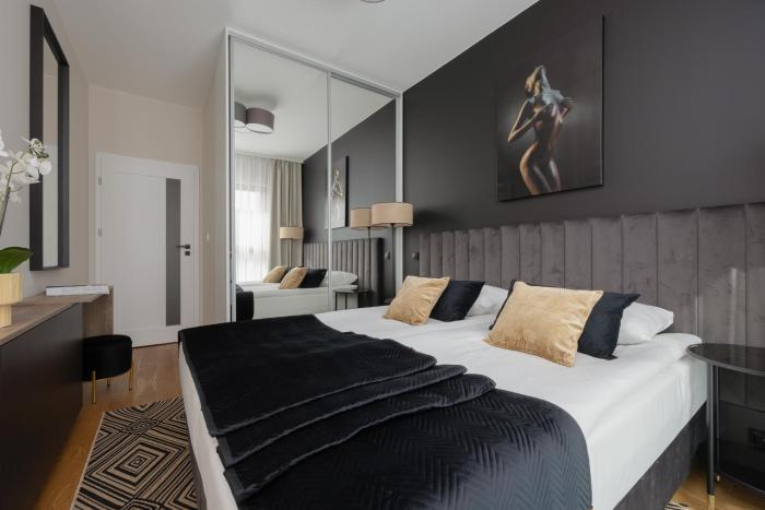 Cozy Apartment with Air Conditioner and Parking by Noclegi Renters