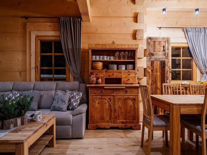 A large mountain-style house with a spa area