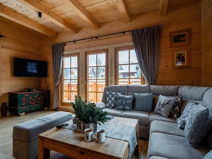 A large mountain-style house with a spa area