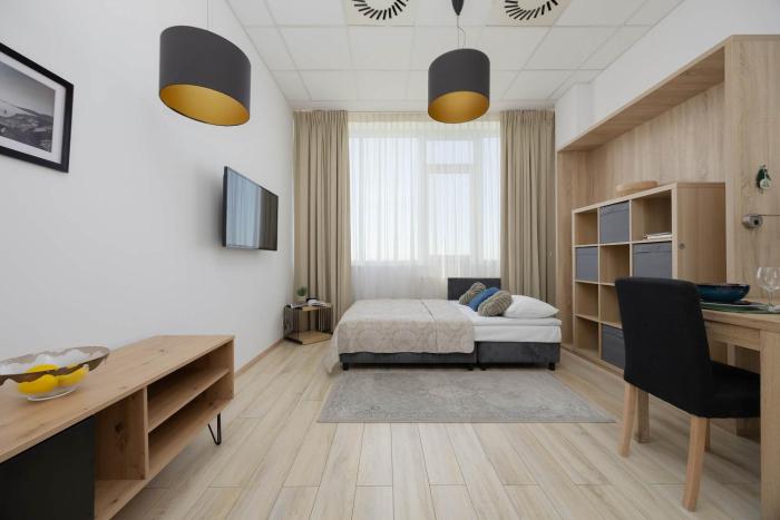 Cosy Studio with a Bath and Parking Space in Warsaw by Noclegi Renters