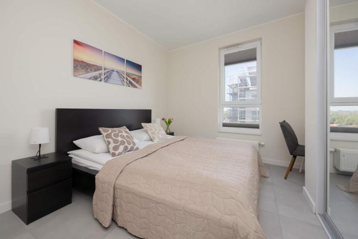 Comfortable Apartment with Air Conditioning and a Family Parking Space by Noclegi Renters