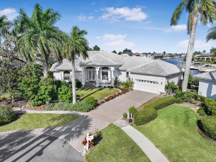 Waterfront home on key lot with pool, spa and views