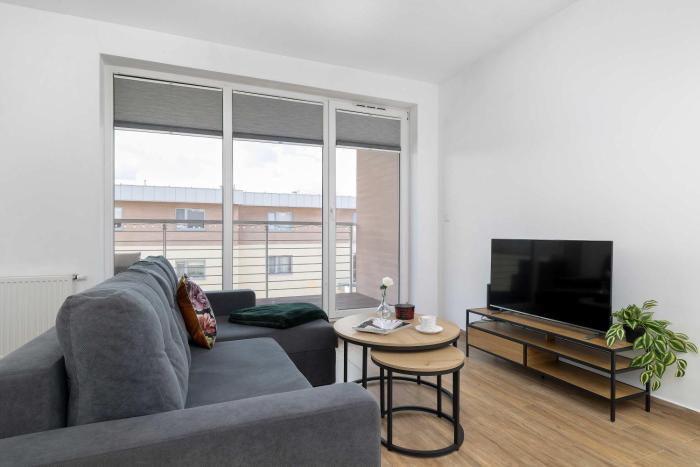 Bright Apartment with a Balcony in Quiet Neighbourhood by Noclegi Renters