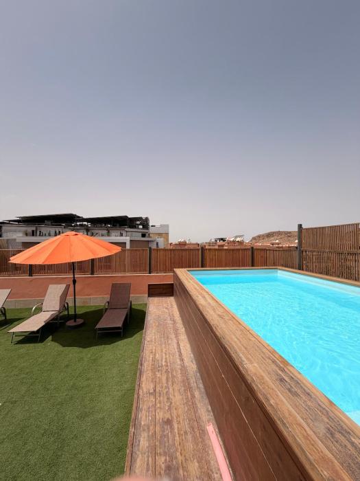 Elegant 1BR Apartment with Terrace & Rooftop Pool
