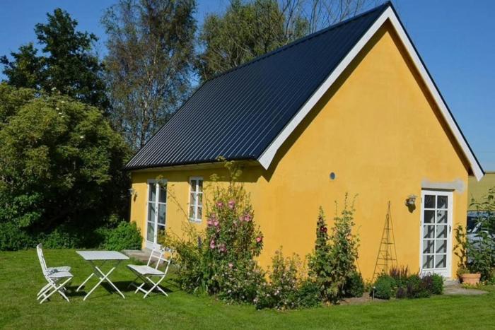 Airy yellow house with high open ceilings