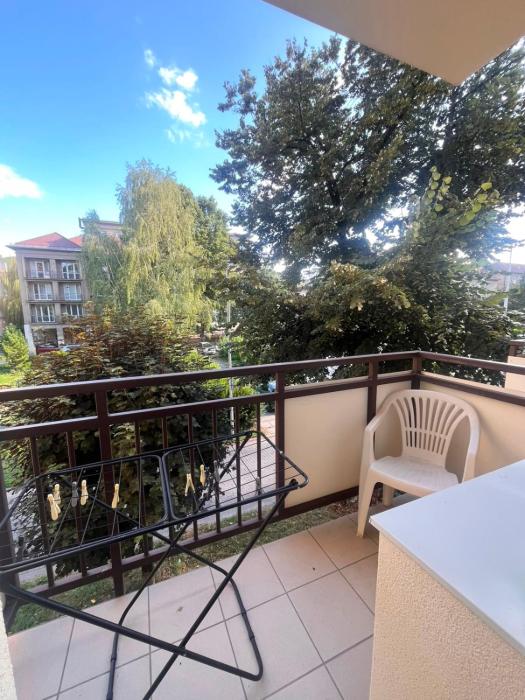 Sunny 1-room apartment with a balcony and parking in the city center