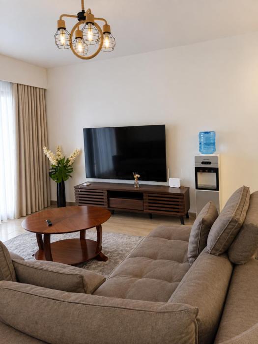 Elegant 2-Bedroom Apartment with Pool & Balcony