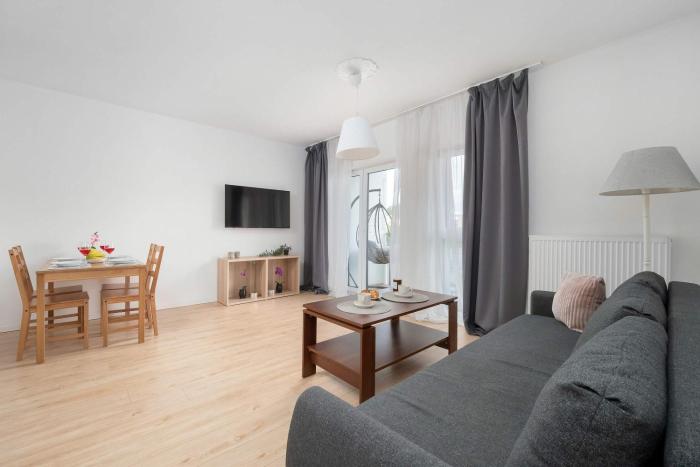 Family Apartment in Łódź with Balcony Close to the Park by Noclegi Renters