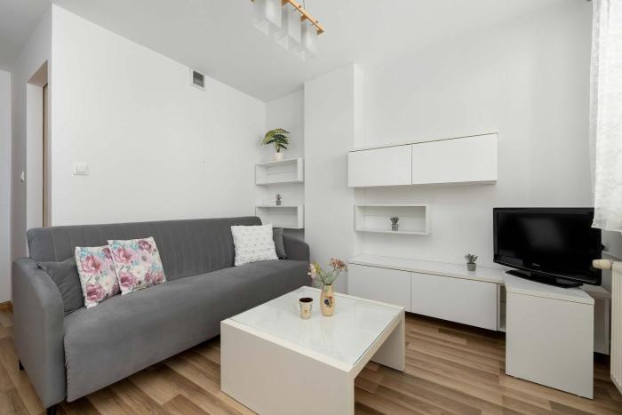 Jasny Apartament w Centrum by Noclegi Renters