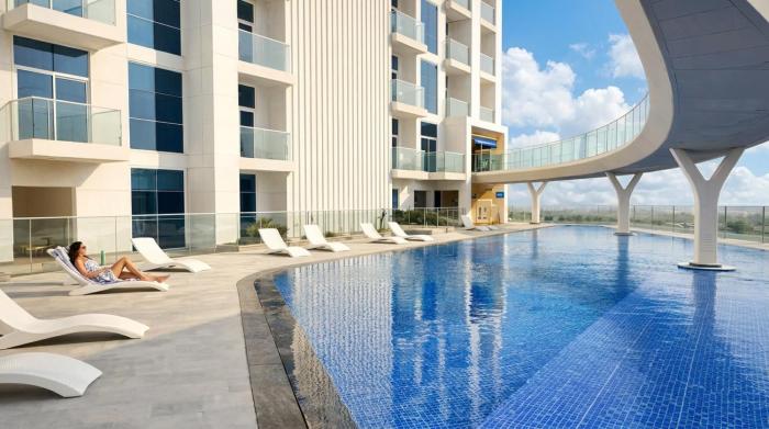 Vogue Vacation Homes, Arjan Skyz by Danube near Miracle Garden, One Bedroom Apartment with Balcony, Community and Dubai Outdoor Kart drome View, Access toAmenities