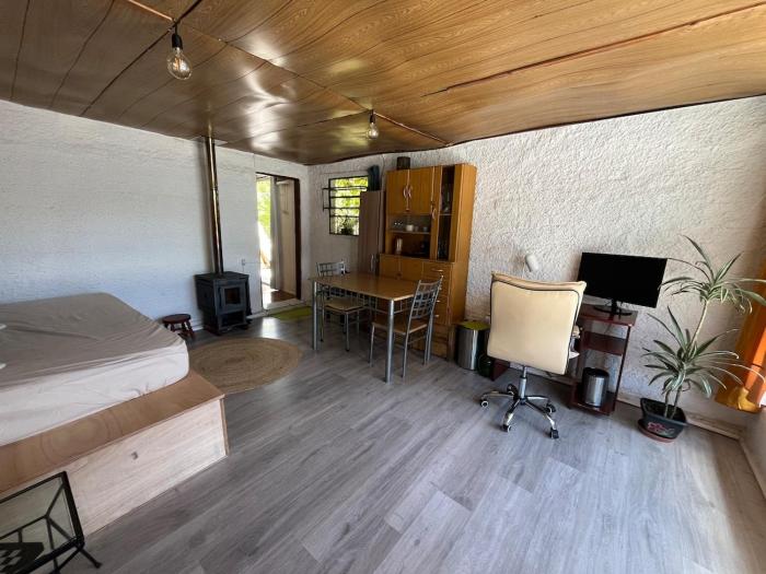 A bright little house in a central location with a wood-burning stove