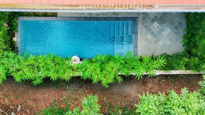 ELIVAAS Signature Casa Isla Heritage-Style 4 BHK Retreat with Private Pool, Balconies, Pillared Verandah & Landscaped Garden