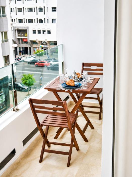 Racine studio élégant avec balcon vue imprenable sur la ville
