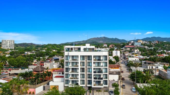 2BR condo in La Cruz with pool, balcony, AC, WiFi & kitchen