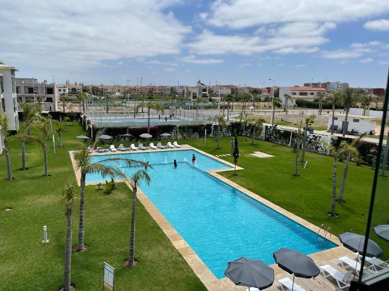 Bel appartement pied sur mer vue imprenable sur piscine et jardins - Chambres d'hôtes Sidi Rahal