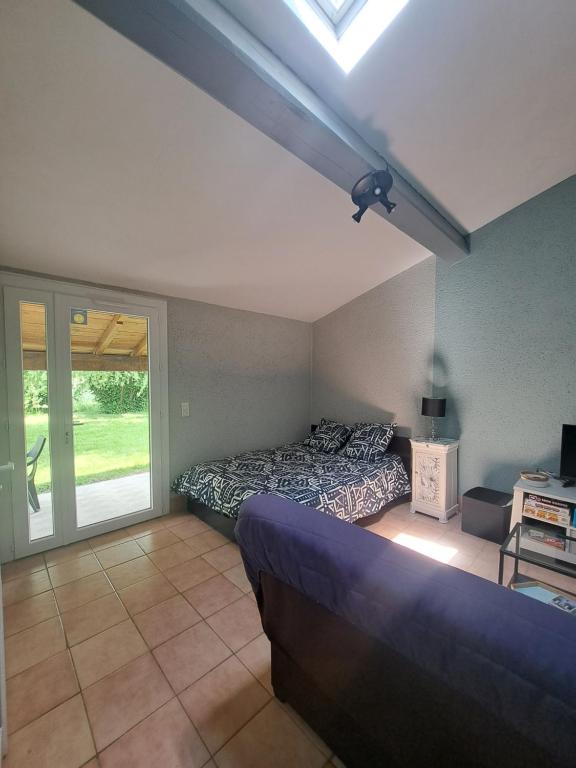 Studio avec jardin à 5 min du Parc Walibi - B&B Roquefort